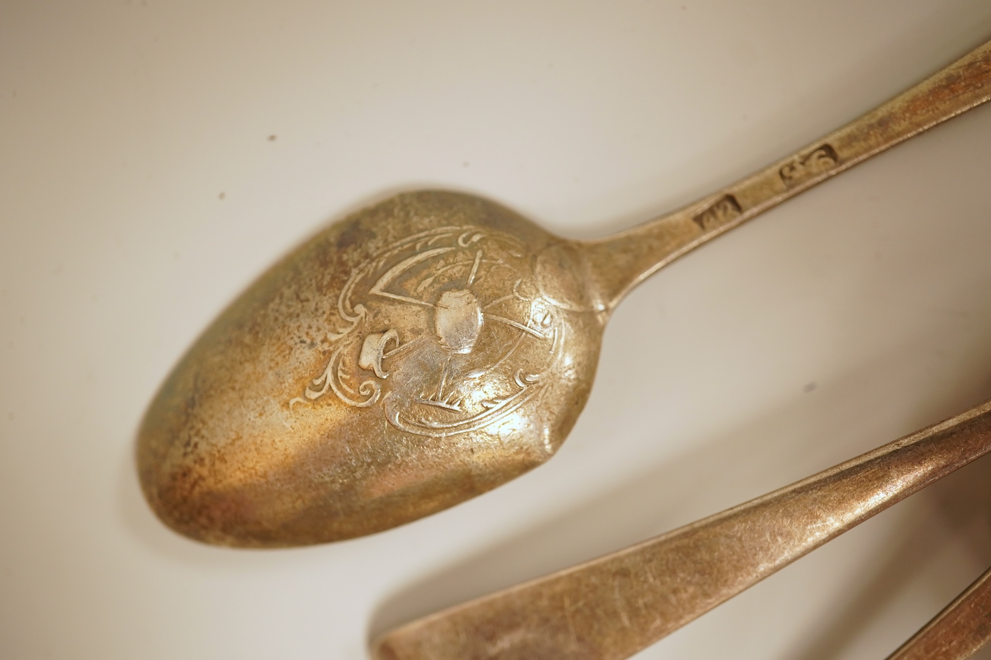 A small quantity of 18th century and later assorted silver teaspoons, various patterns, dates and makers, together with a George V silver pastry fork and two George V silver caddy spoons, 10.7oz.